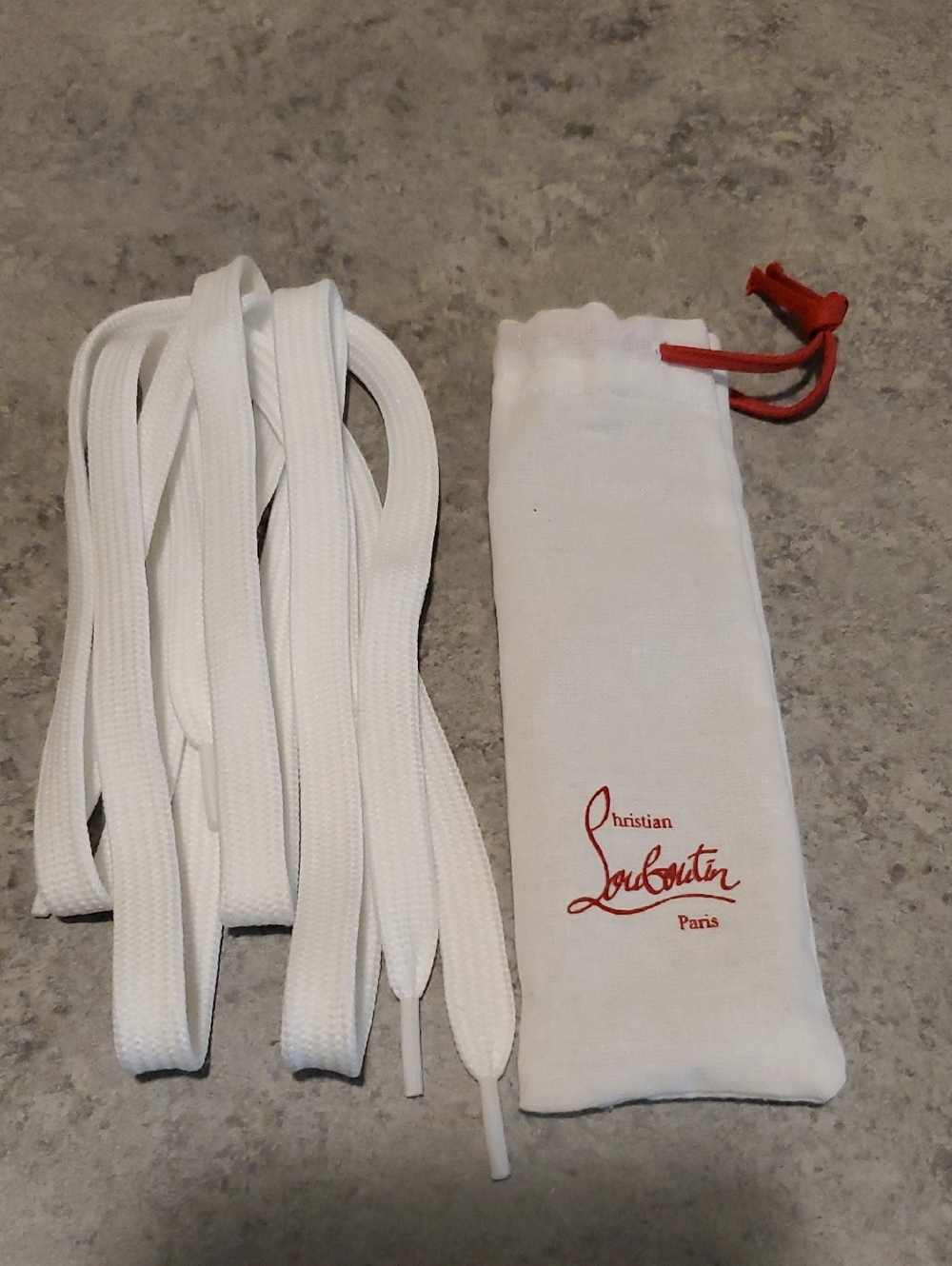 Christian Louboutin White Shoelaces with White Branded Pouch and Red Drawstring